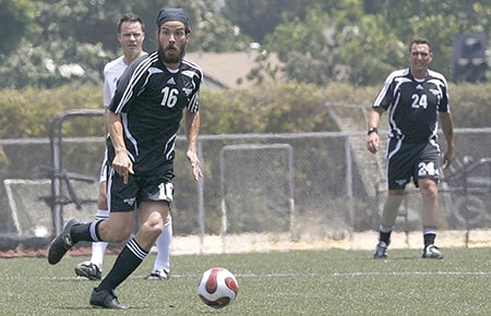 Actor Santiago Cabrera playing soccer for charity