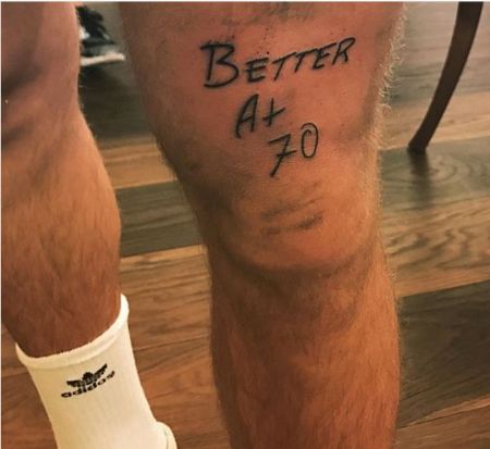 Justin's "Better at 70" tattoo