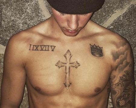 Justin's "I IX VII V" tattoo and other assorted ink