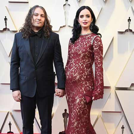 Krysten Ritter with her longtime boyfriend, Adam Graduciel at the Oscars.