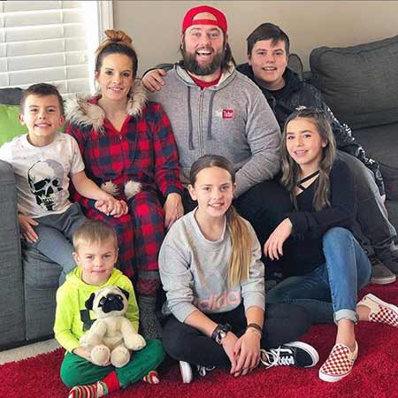 Shay Carl with his wife, Colette Crofts and their five children.