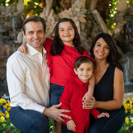 Neil Hopkins and his wife Saba with their two children